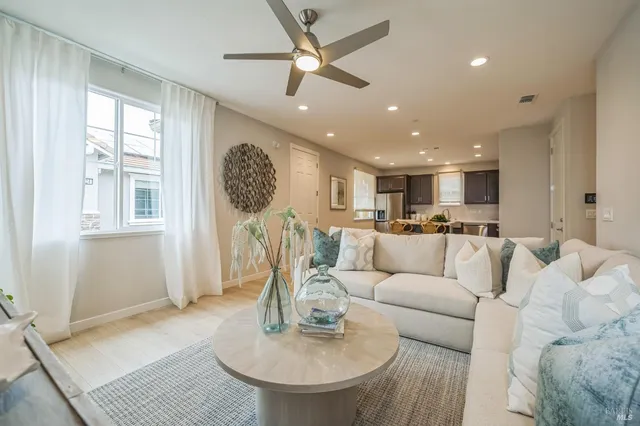 a picture of a room with a white wall and white refrigerator