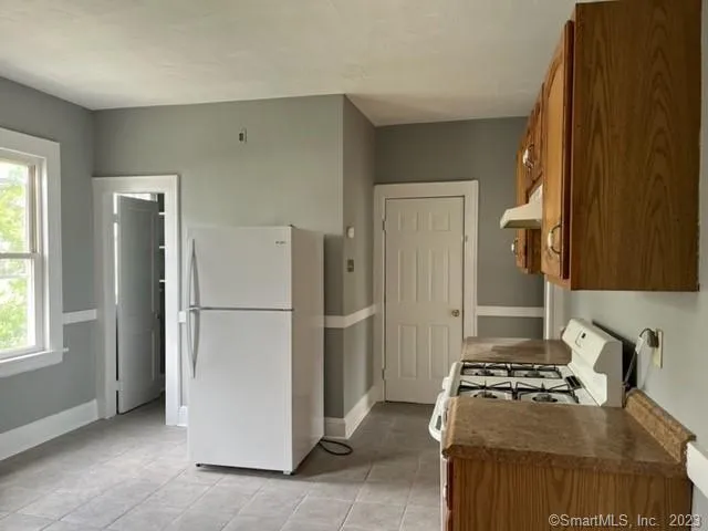 a kitchen with a stove a refrigerator and a stove