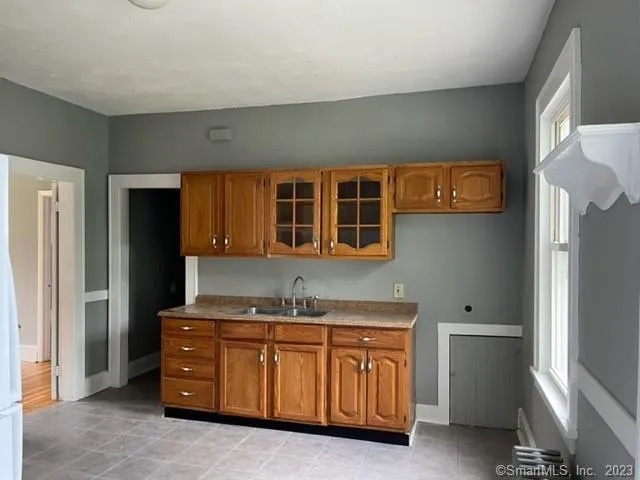 a kitchen with stainless steel appliances granite countertop a refrigerator and a stove