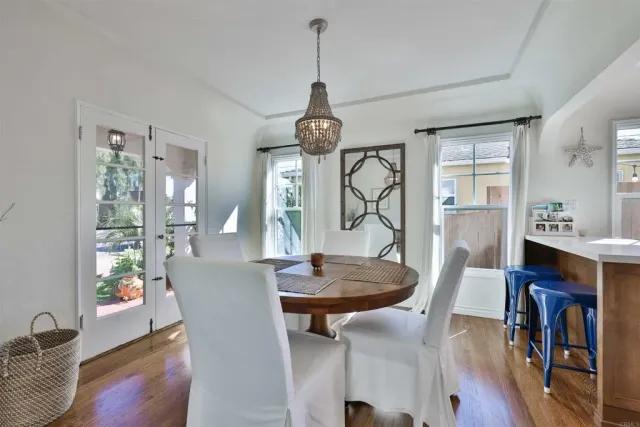 a view of a livingroom with furniture and a chandelier
