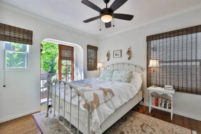 a bedroom with a large bed and a window