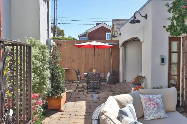 a outdoor living space with furniture and a potted plant