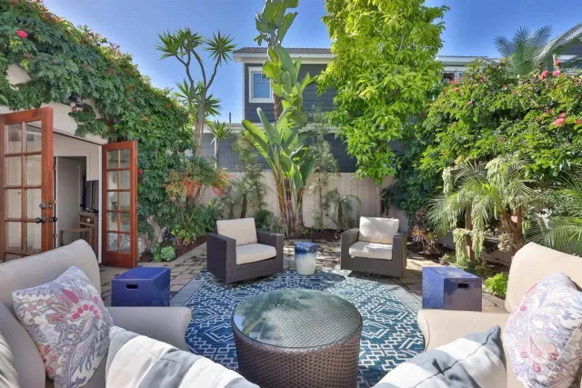 a living room with patio furniture