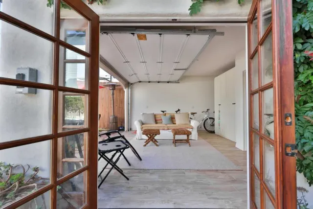 a view of a patio with table and chairs and potted plants