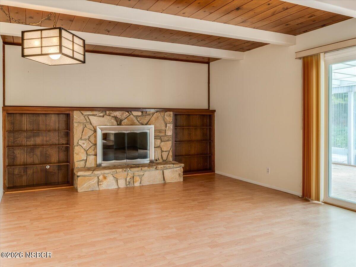 360 Tallyho Road Santa Maria, CA 93455 - Photo 30 of 72 a view of an empty room with a fireplace and a window