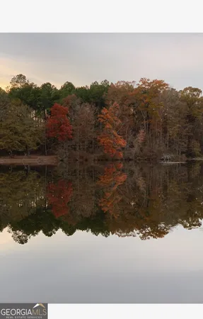 a view of a lake with houses in the back