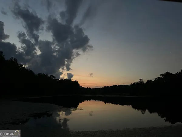 a view of lake with green space