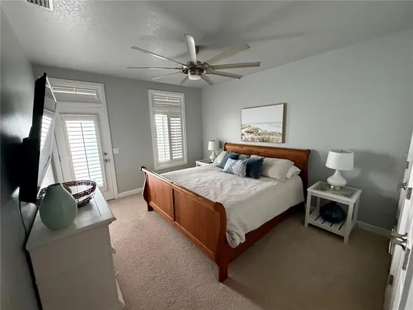 a bedroom with two beds and a window