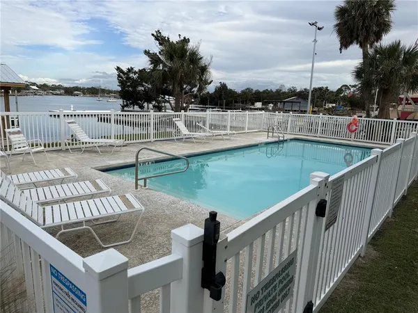 a view of a swimming pool with a lake view