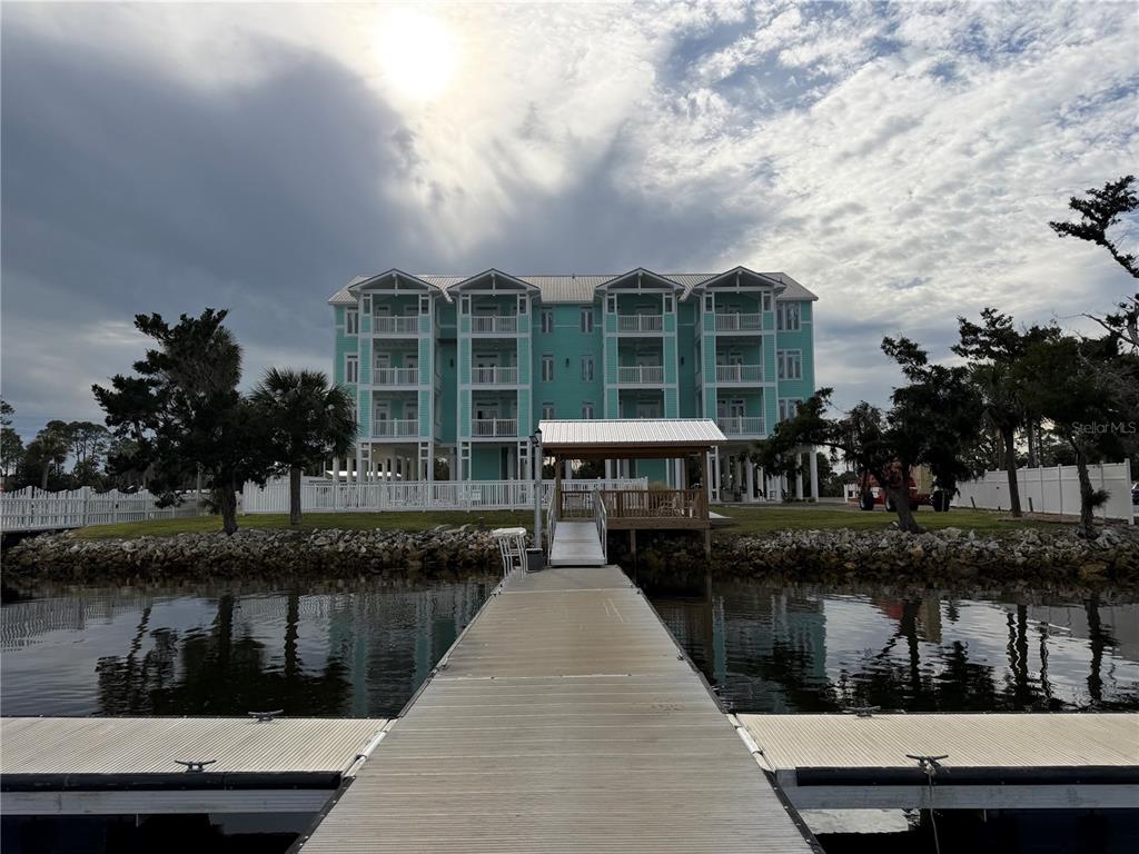 6990 Southwest Highway 358, Unit 2B Steinhatchee, FL 32359 - Photo 6 of 13 a front view of a house with a lake view