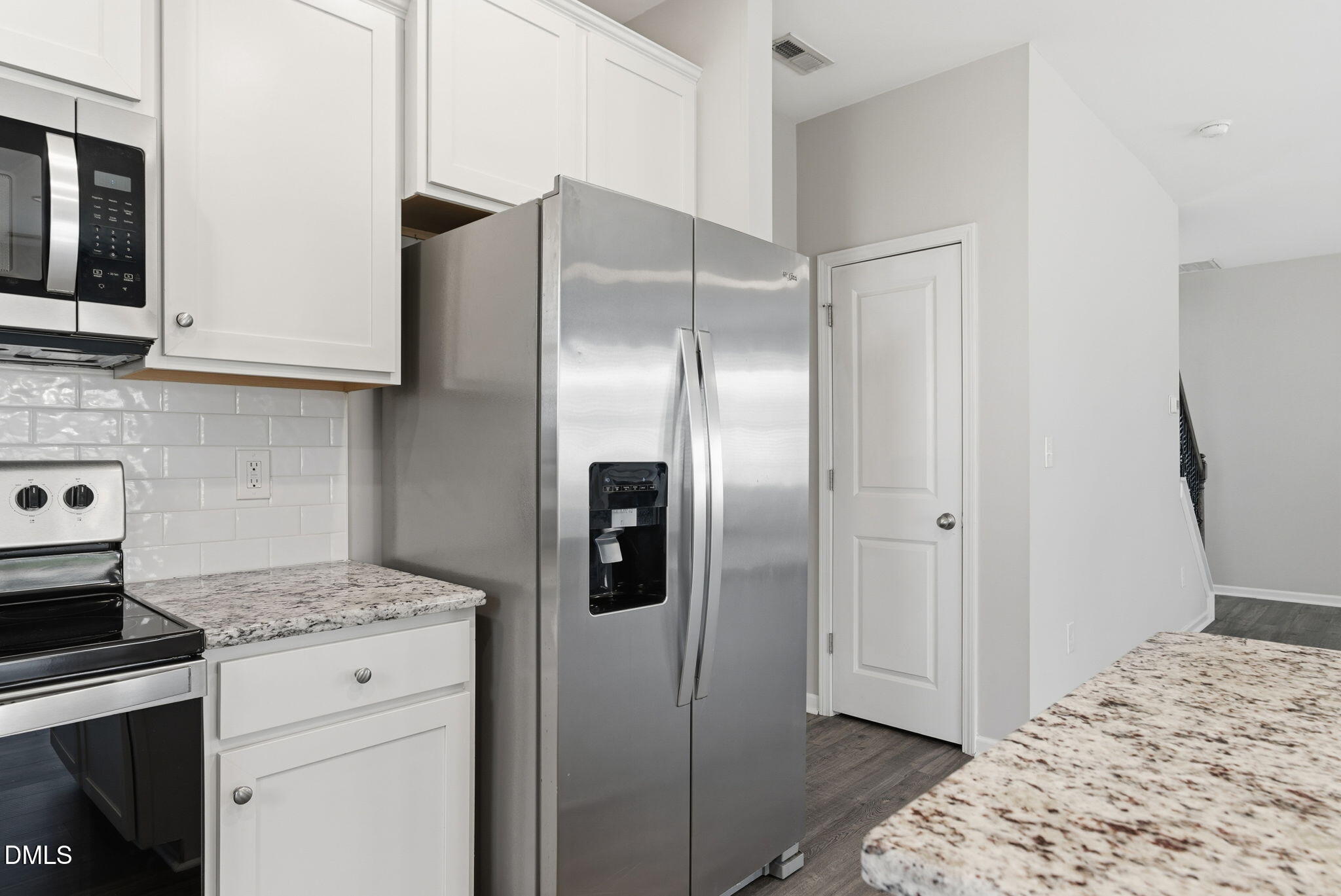 48 Weathervane Dr. Zebulon, NC 27597 - Photo 24 of 68 a kitchen with stainless steel appliances granite countertop a refrigerator and a stove top oven