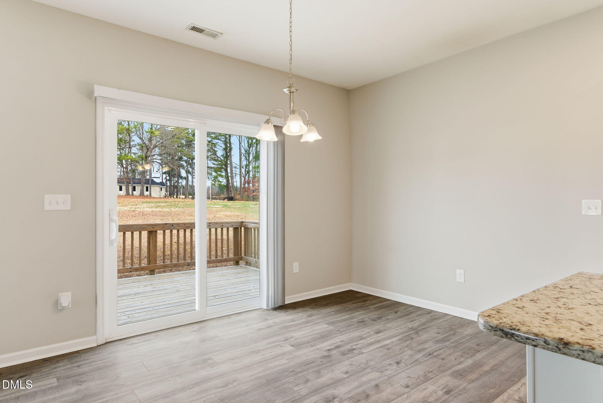 48 Weathervane Dr. Zebulon, NC 27597 - Photo 28 of 68 a view of an empty room with glass door and balcony