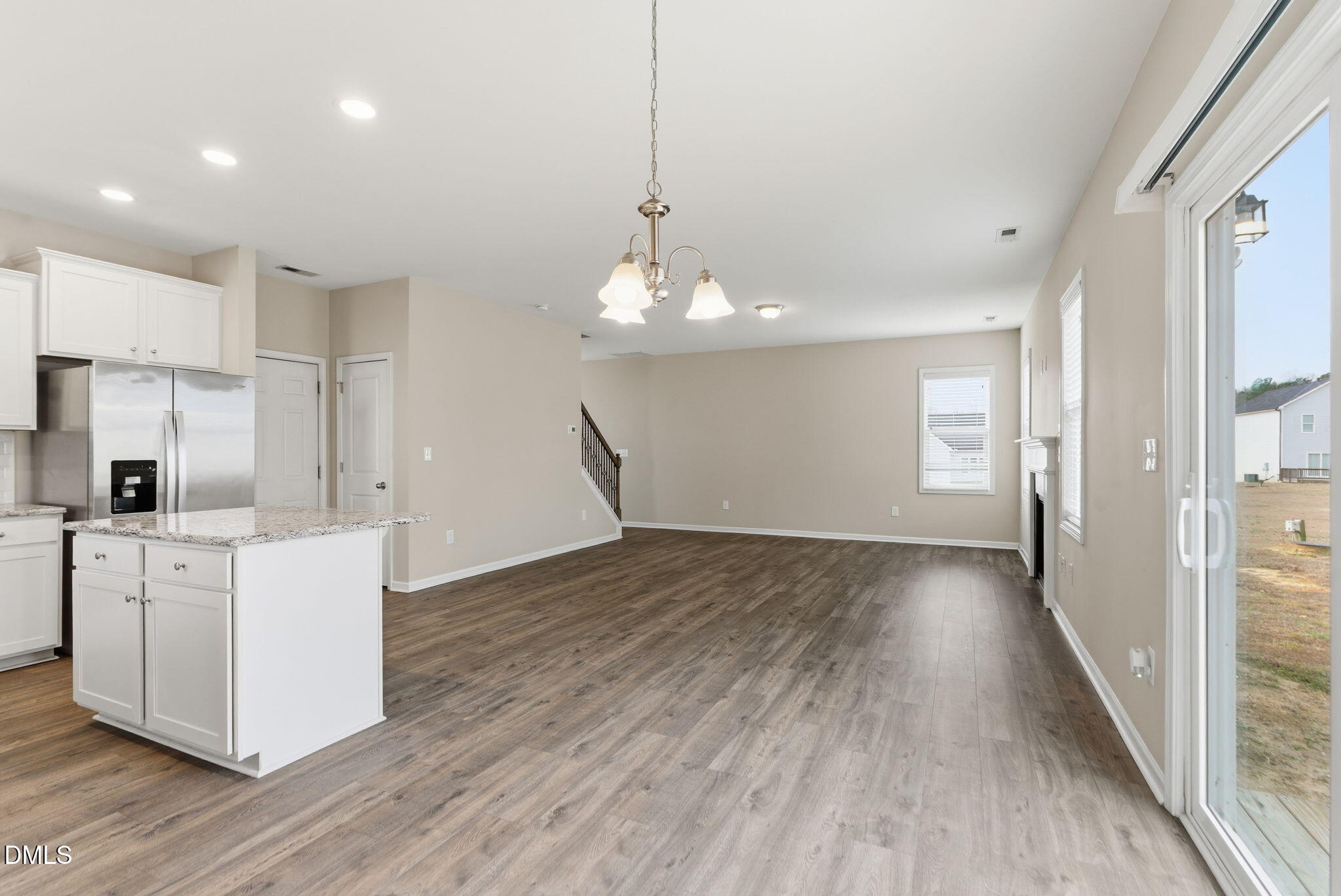 48 Weathervane Dr. Zebulon, NC 27597 - Photo 29 of 68 a view of a kitchen with wooden floor and a window
