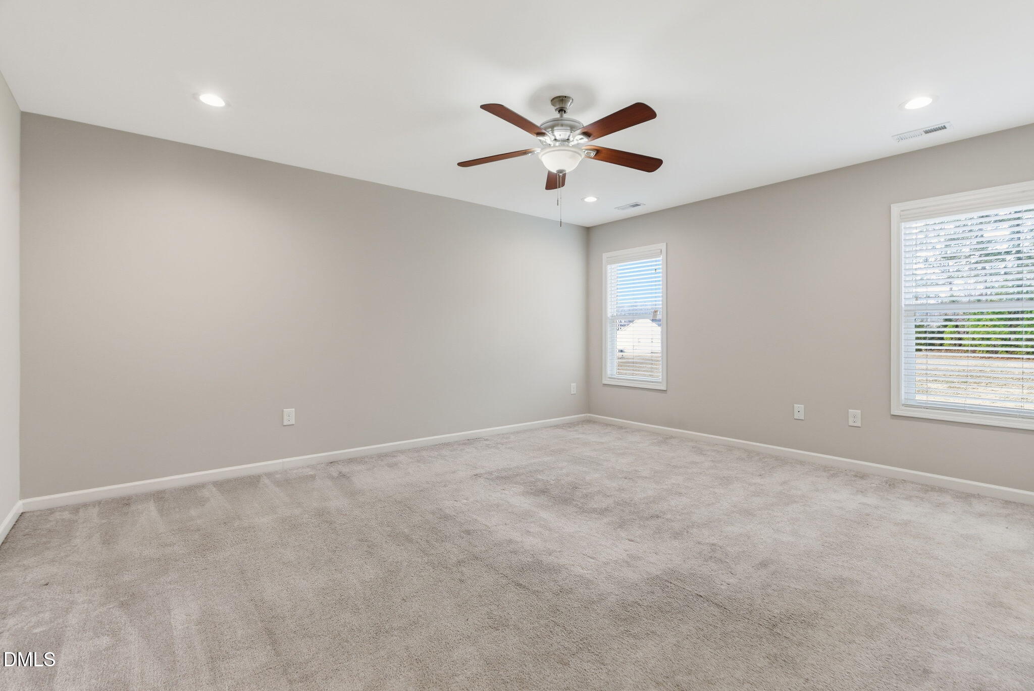 48 Weathervane Dr. Zebulon, NC 27597 - Photo 34 of 68 an empty room with a window and a fan
