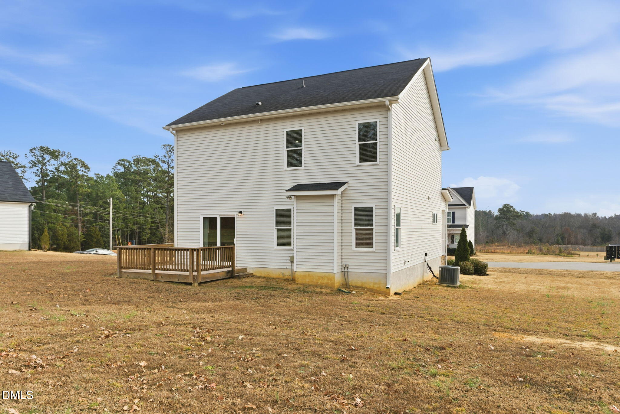 48 Weathervane Dr. Zebulon, NC 27597 - Photo 53 of 68 a view of a terrace with a bench