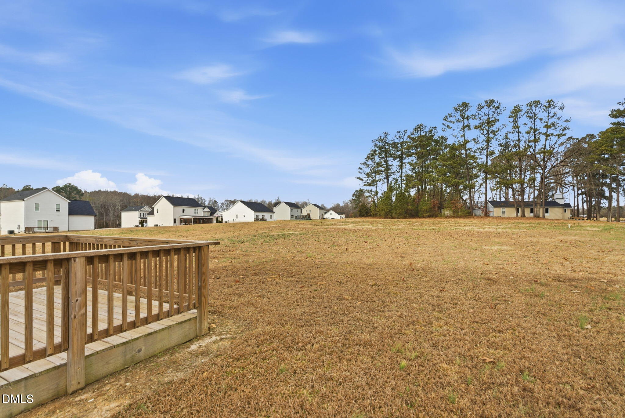 48 Weathervane Dr. Zebulon, NC 27597 - Photo 54 of 68 a view of a lake with houses in front of it
