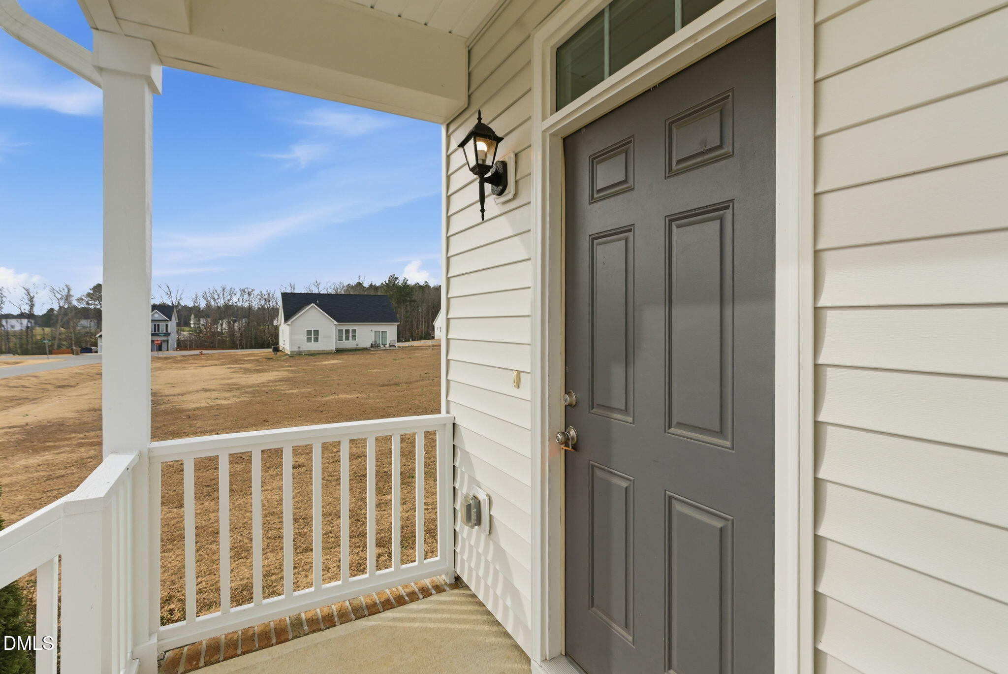 48 Weathervane Dr. Zebulon, NC 27597 - Photo 9 of 68 a view of a balcony from a door