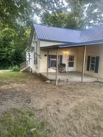a front view of a house with a porch