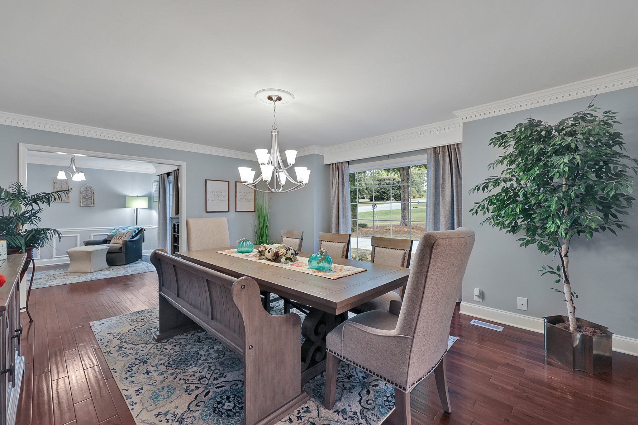 8122 Holly Road Brentwood, TN 37027 - Photo 14 of 65 a view of a dining room with furniture window and wooden floor