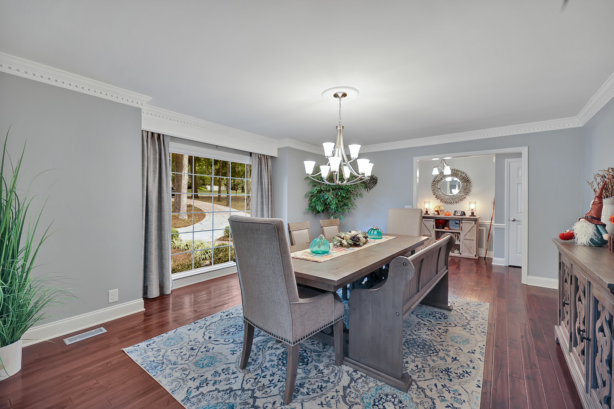 8122 Holly Road Brentwood, TN 37027 - Photo 15 of 65 a view of a dining room with furniture wooden floor and chandelier