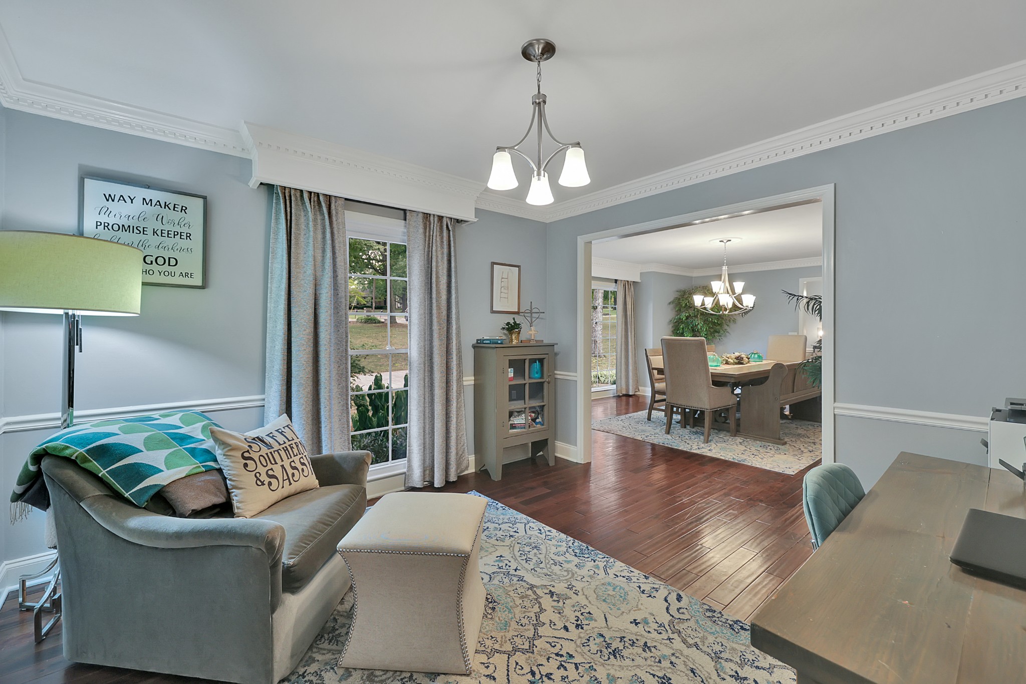 8122 Holly Road Brentwood, TN 37027 - Photo 17 of 65 a living room with furniture chandelier and a table