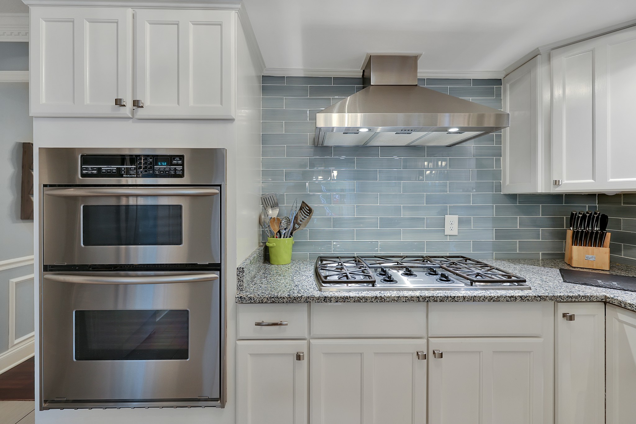 8122 Holly Road Brentwood, TN 37027 - Photo 21 of 65 a kitchen with stainless steel appliances granite countertop a stove a microwave and cabinets