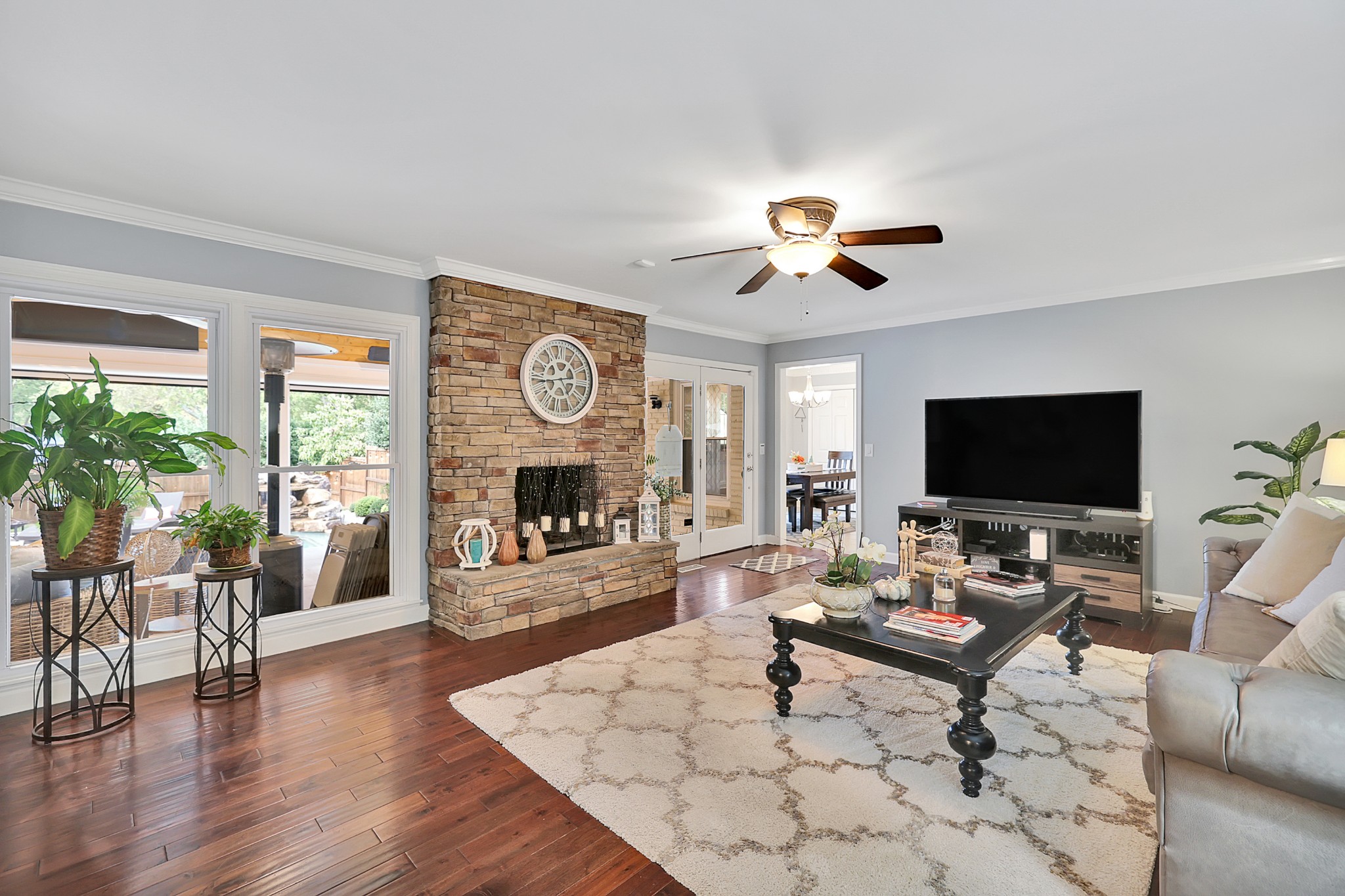 8122 Holly Road Brentwood, TN 37027 - Photo 25 of 65 a living room with furniture and a flat screen tv with wooden floor