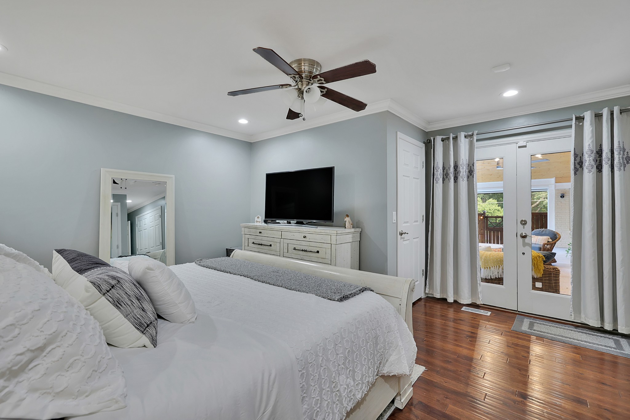 8122 Holly Road Brentwood, TN 37027 - Photo 29 of 65 a bed room with a bed and a flat screen tv
