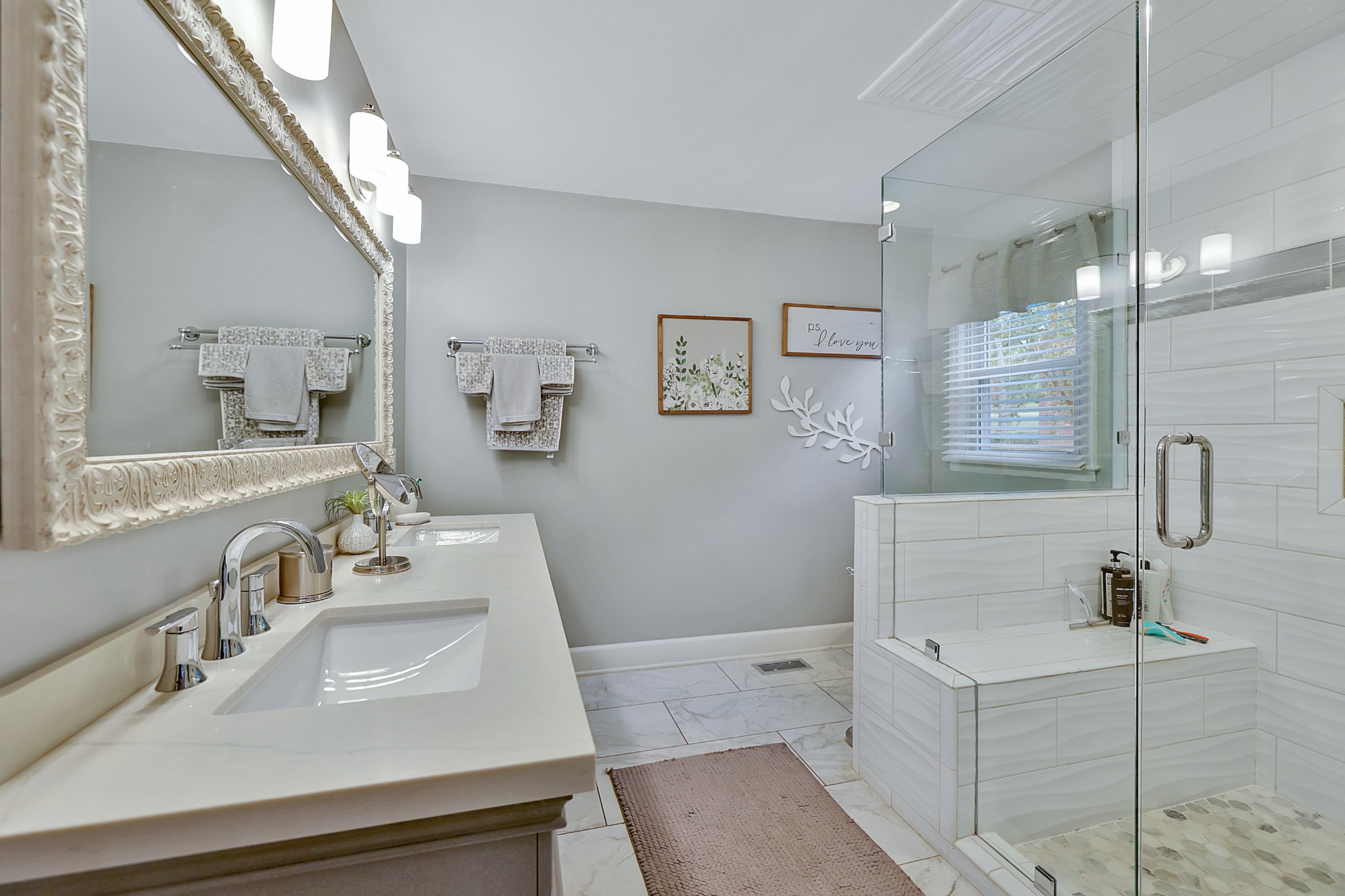 8122 Holly Road Brentwood, TN 37027 - Photo 31 of 65 a bathroom with a sink a toilet a mirror and shower