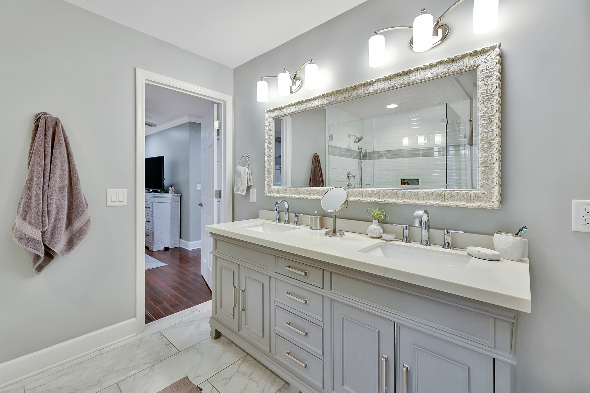 8122 Holly Road Brentwood, TN 37027 - Photo 32 of 65 a spacious bathroom with a double vanity sink and a mirror