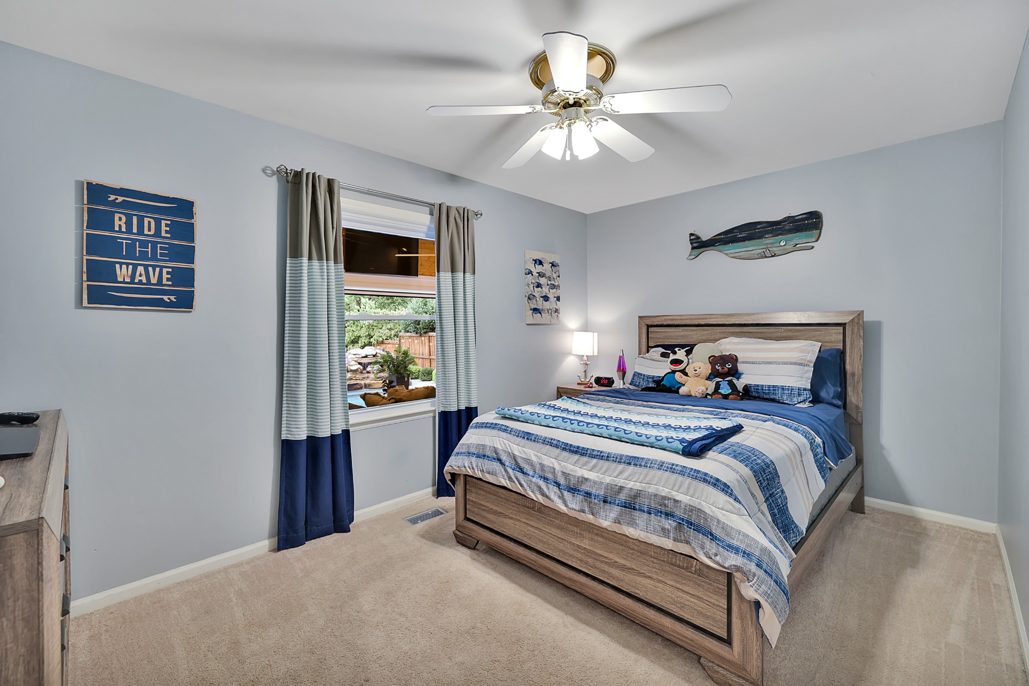 8122 Holly Road Brentwood, TN 37027 - Photo 34 of 65 a bedroom with a large bed and a chandelier
