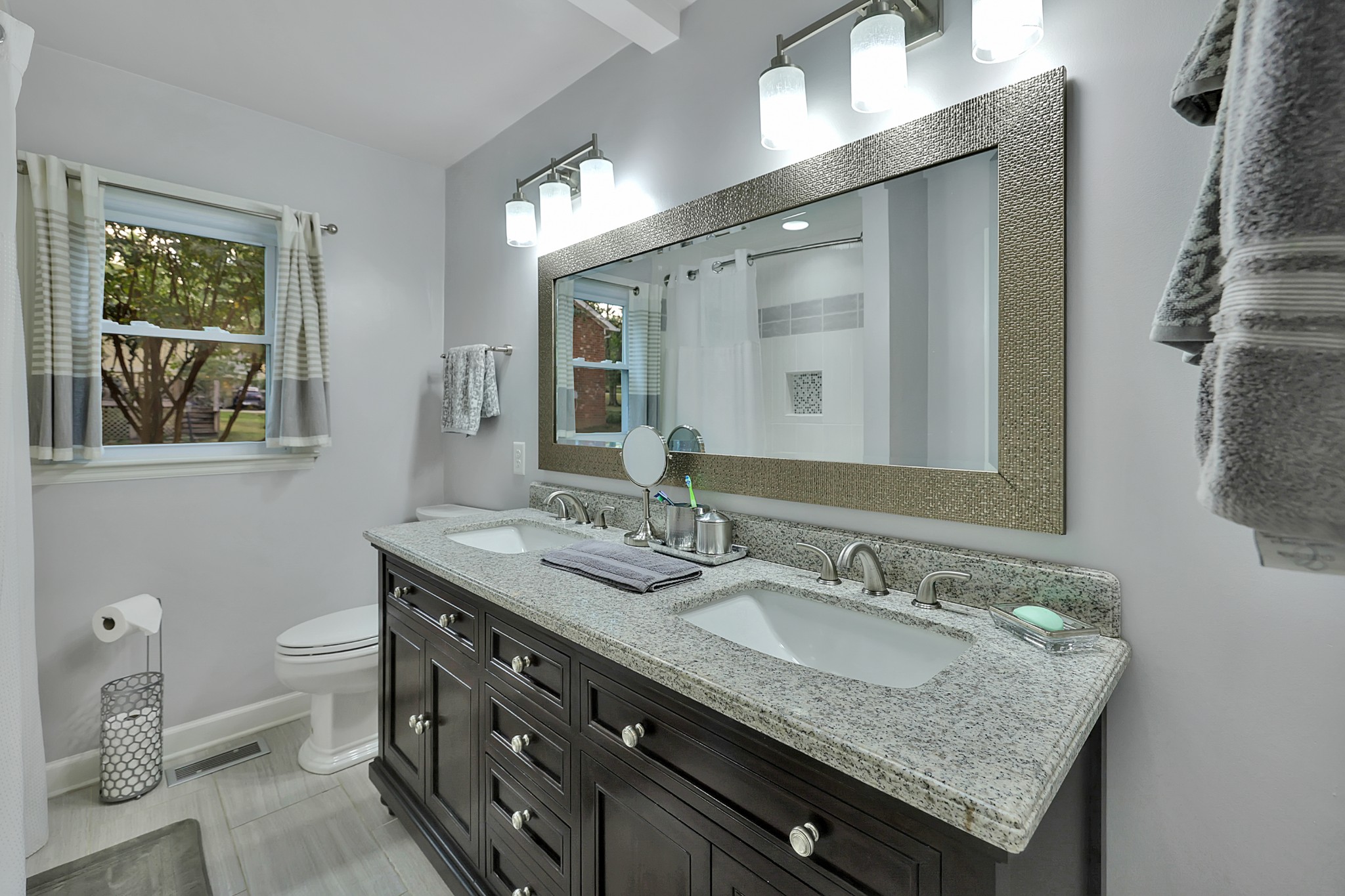 8122 Holly Road Brentwood, TN 37027 - Photo 37 of 65 a bathroom with a granite countertop sink and a mirror