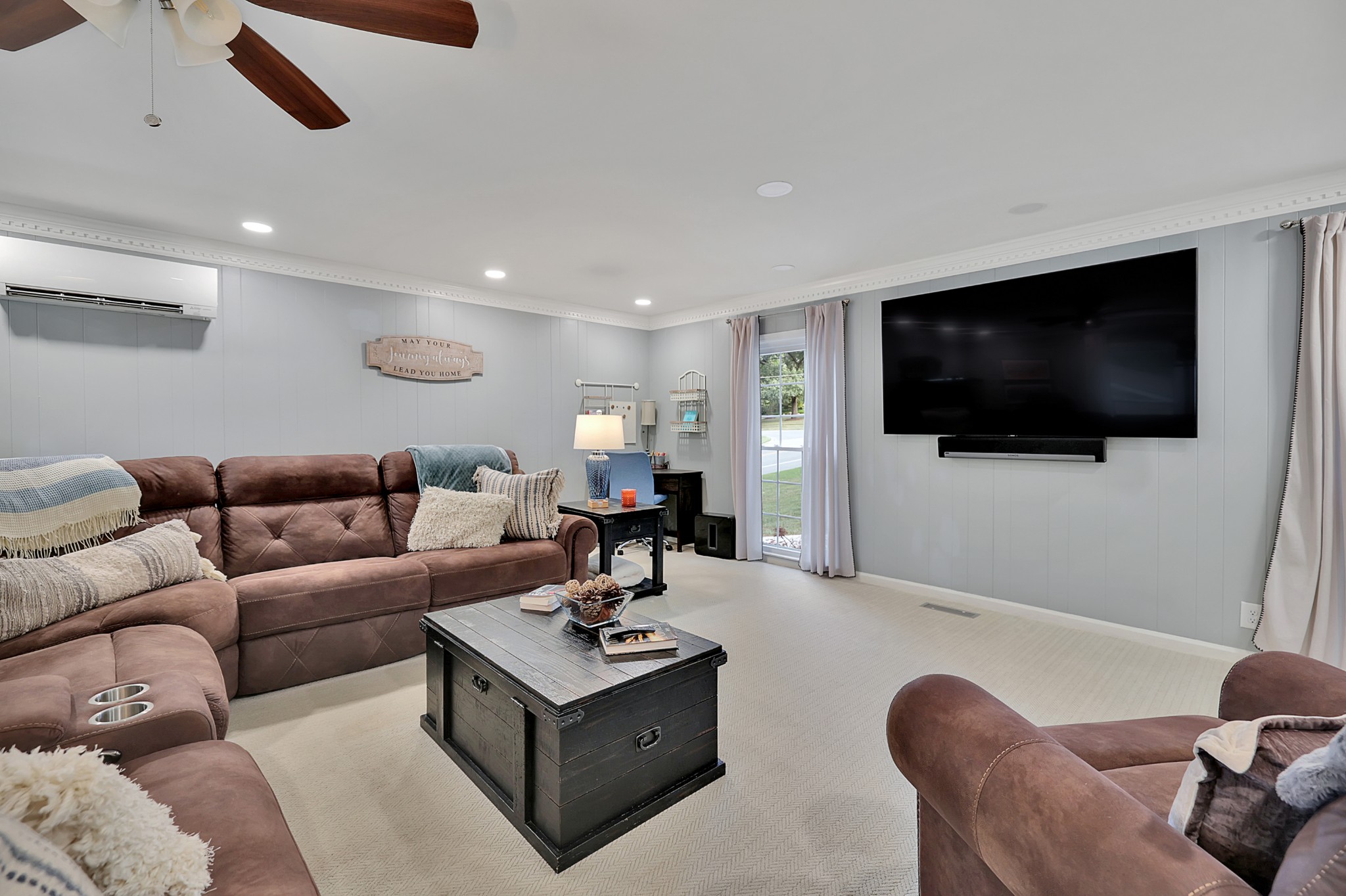 8122 Holly Road Brentwood, TN 37027 - Photo 39 of 65 a living room with furniture and a flat screen tv