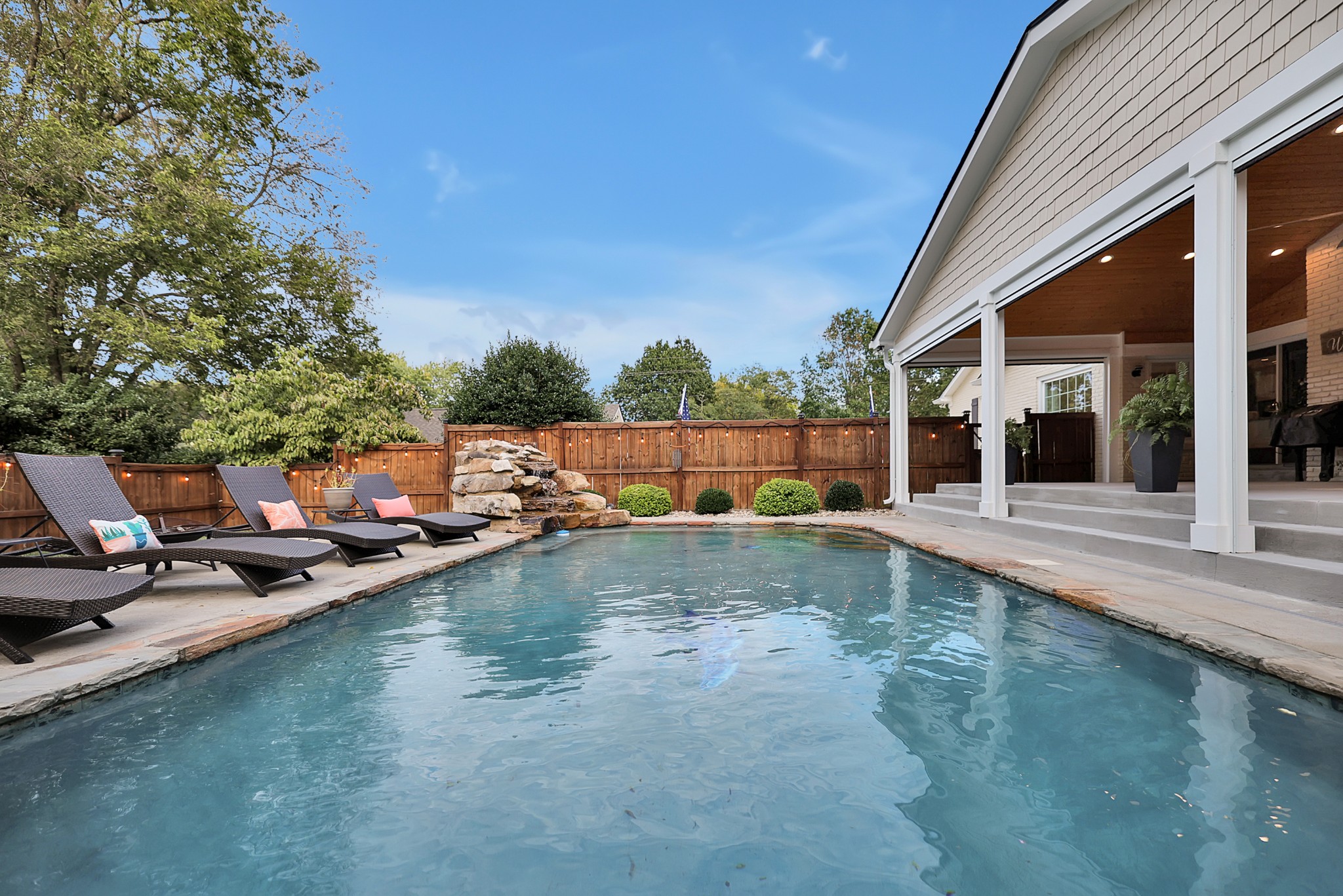 8122 Holly Road Brentwood, TN 37027 - Photo 46 of 65 a view of a swimming pool with a lounge chairs