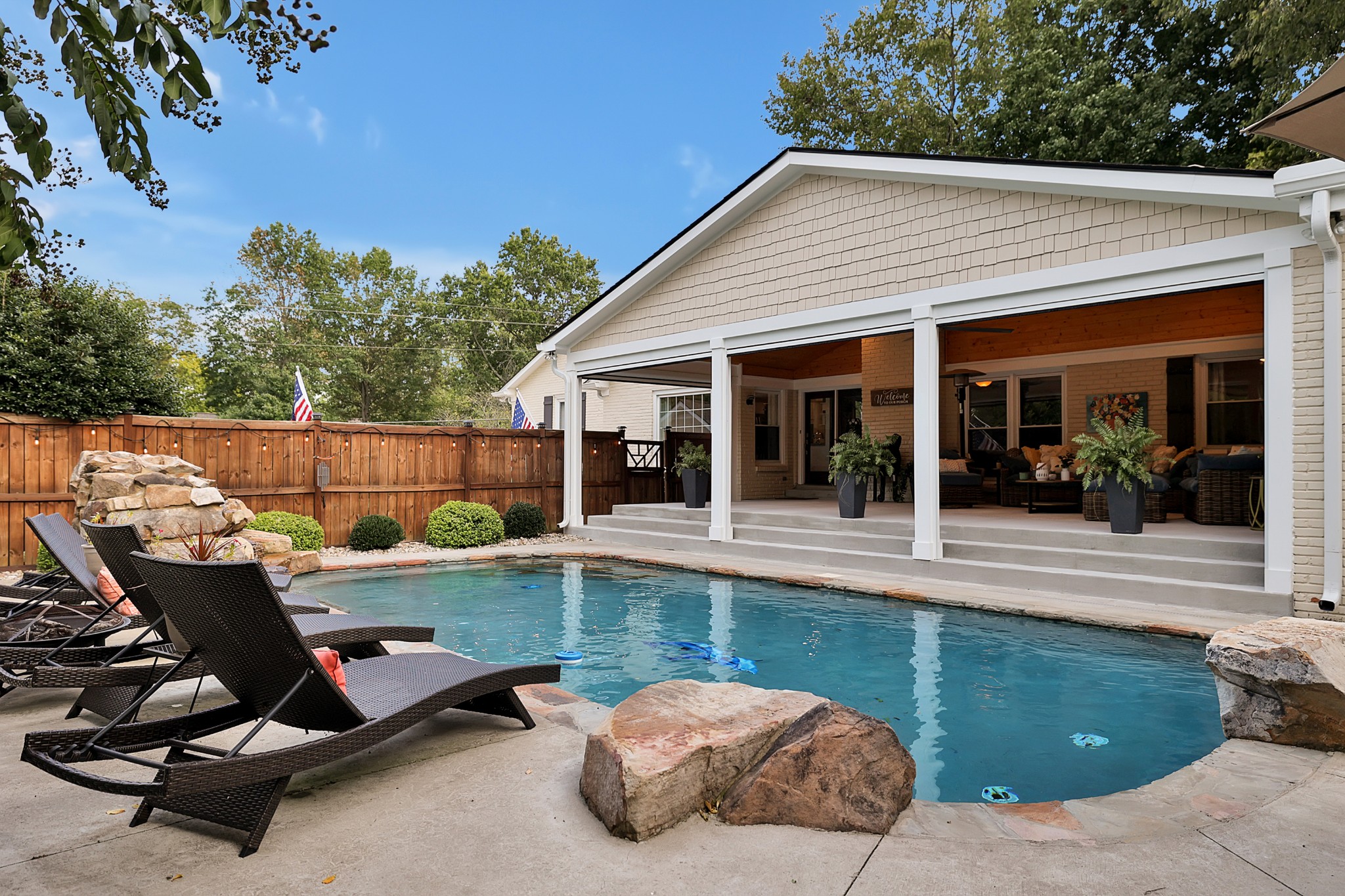 8122 Holly Road Brentwood, TN 37027 - Photo 49 of 65 a view of a chairs and table in backyard of the house