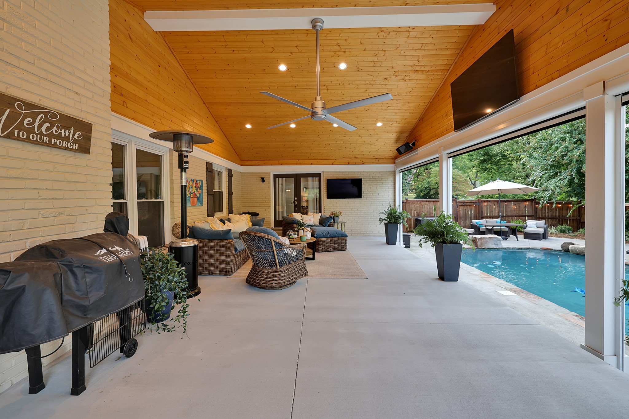 8122 Holly Road Brentwood, TN 37027 - Photo 56 of 65 a living room with furniture and a potted plant