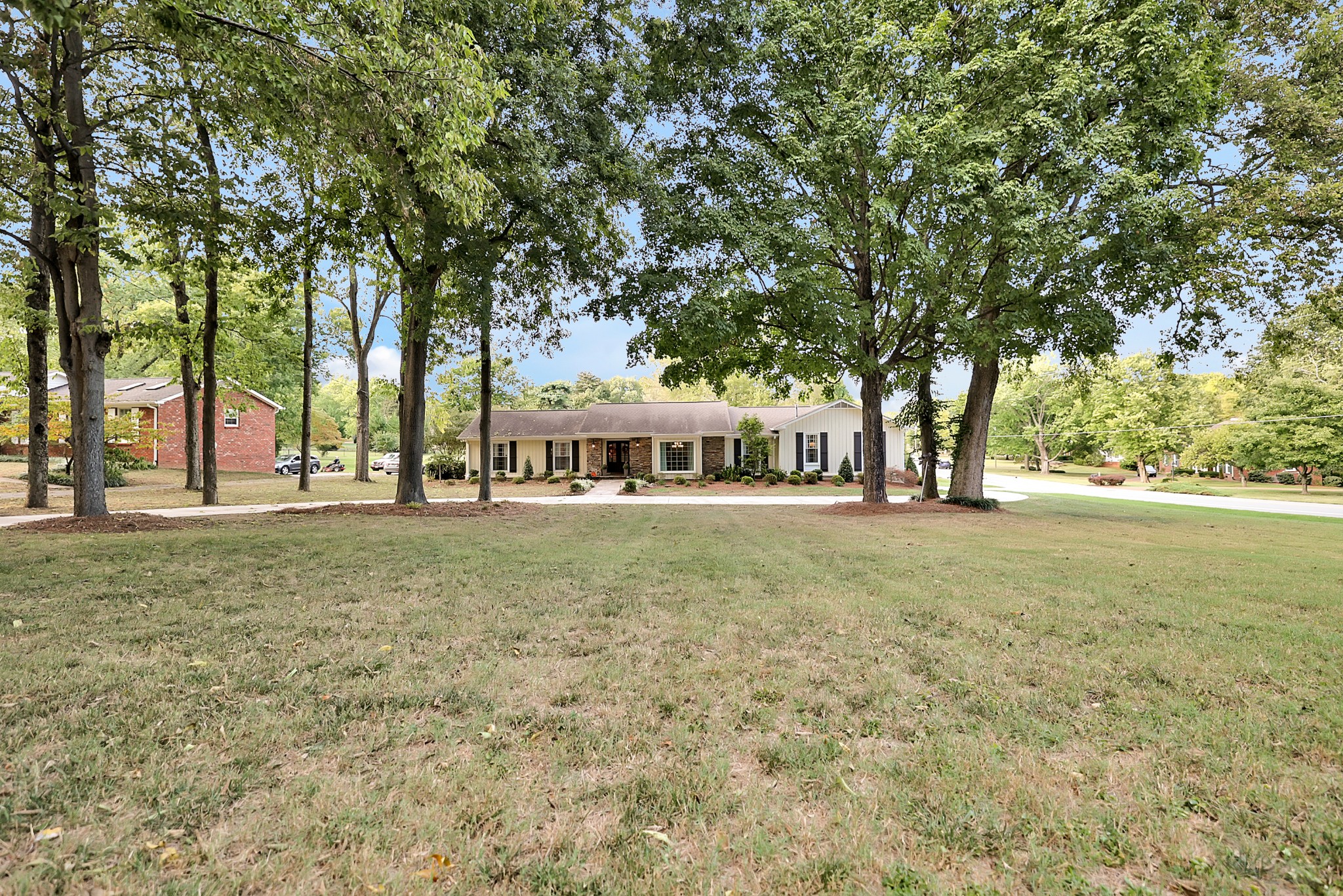 8122 Holly Road Brentwood, TN 37027 - Photo 6 of 65 a view of outdoor space with deck and trees