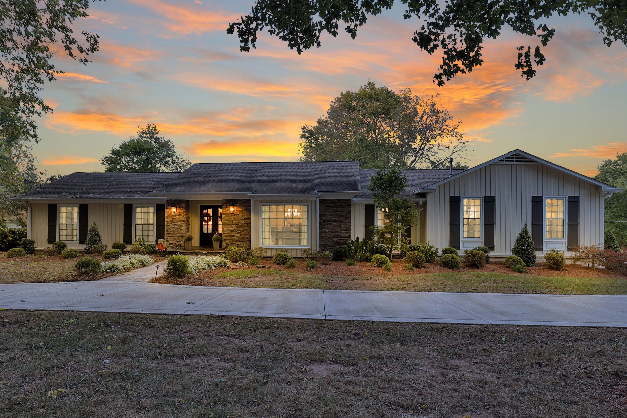 8122 Holly Road Brentwood, TN 37027 - Photo 8 of 65 a front view of a house with entertaining space