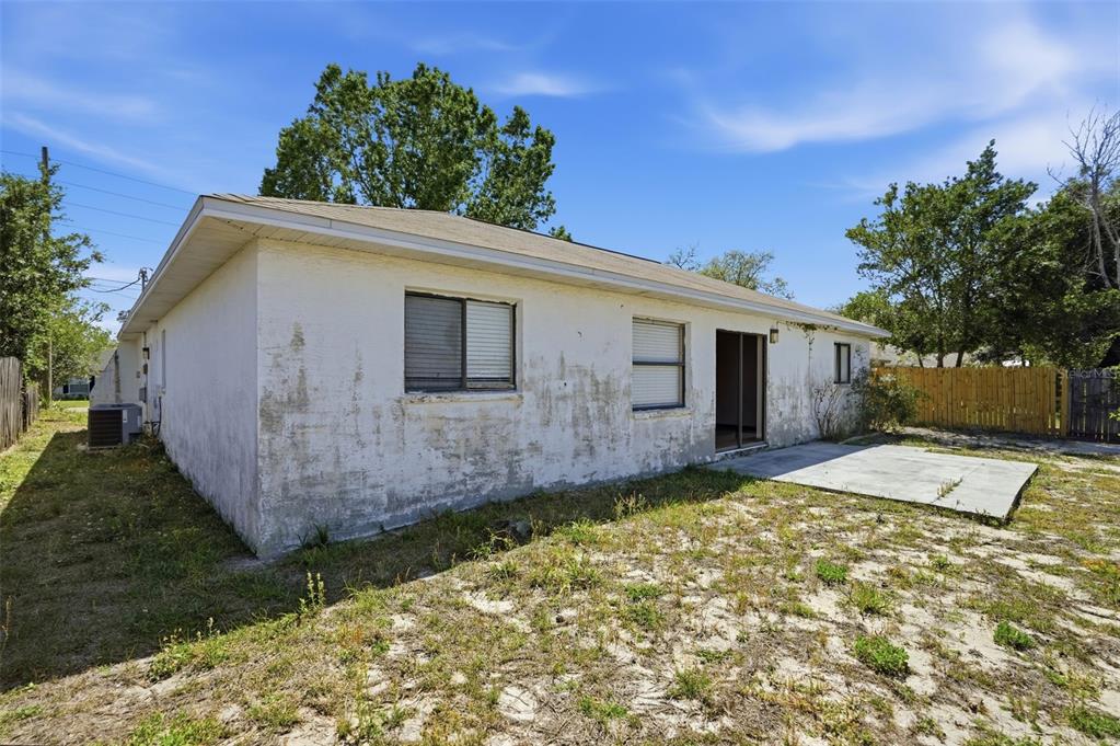 7443 Wabash Trail Spring Hill, FL 34606 - Photo 26 of 40 a view of a house with a yard