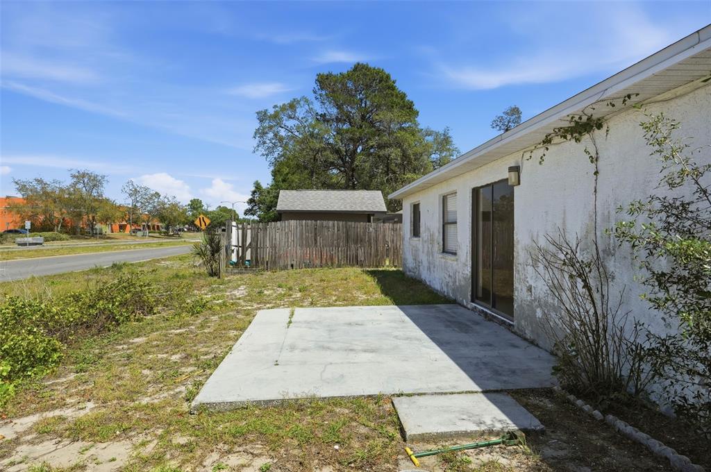 7443 Wabash Trail Spring Hill, FL 34606 - Photo 27 of 40 a view of a back yard with green space