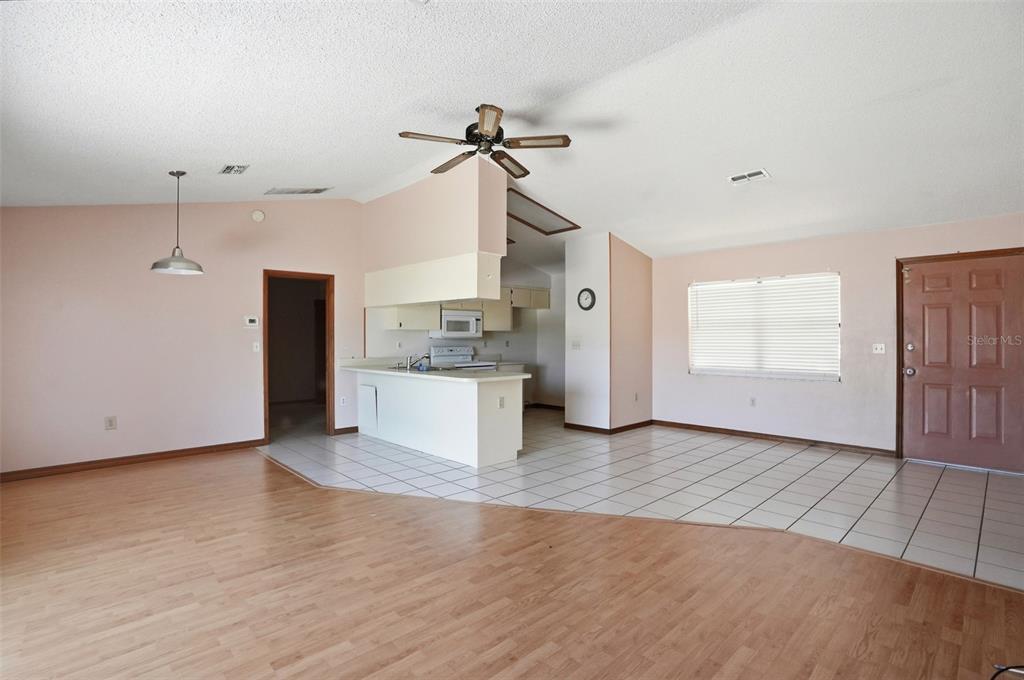 7443 Wabash Trail Spring Hill, FL 34606 - Photo 6 of 40 a view of a kitchen with a sink and a refrigerator