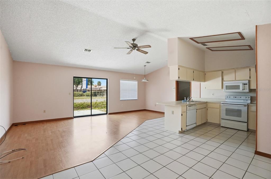 7443 Wabash Trail Spring Hill, FL 34606 - Photo 10 of 40 a view of a kitchen with a sink and microwave