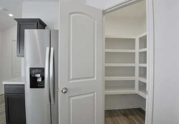 a refrigerator freezer sitting in a kitchen