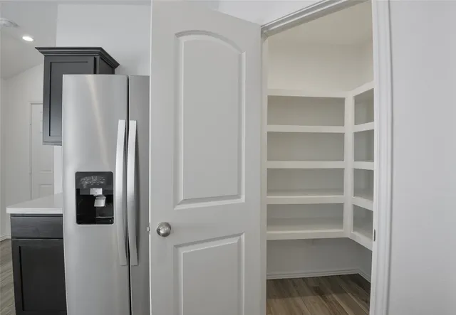 a refrigerator freezer sitting in a kitchen