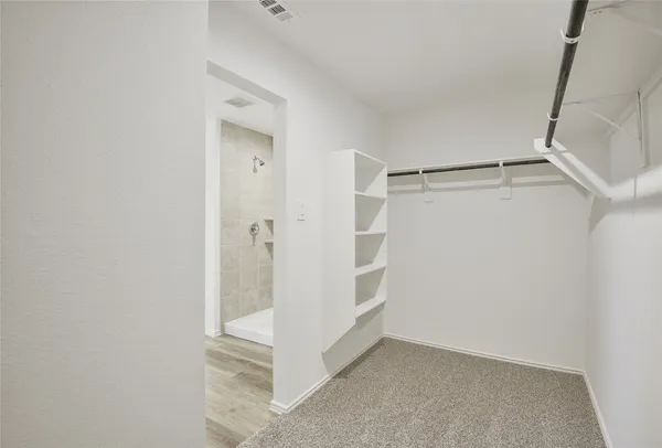 a view of an empty walk in closet