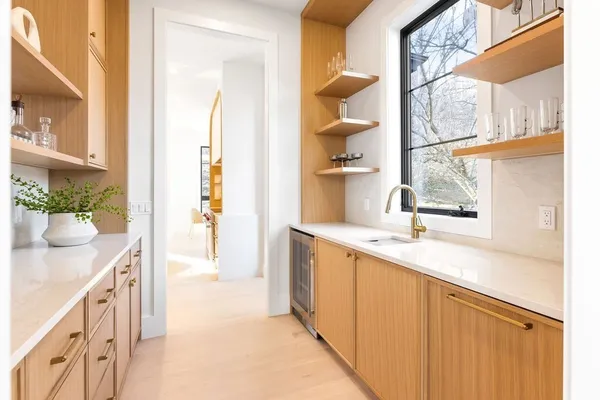 a kitchen with a sink and cabinets