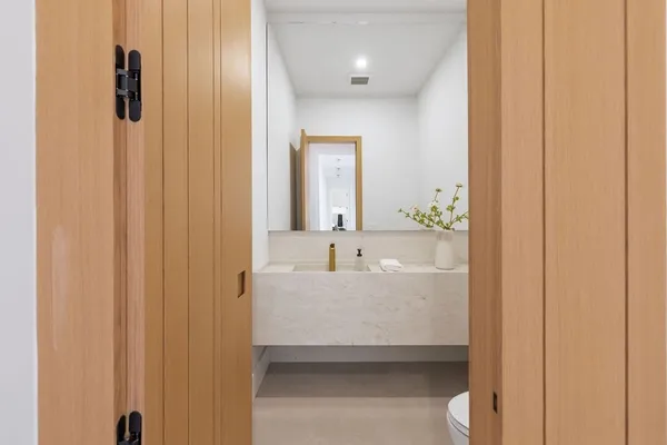 a en suite bathroom with a sink and a mirror