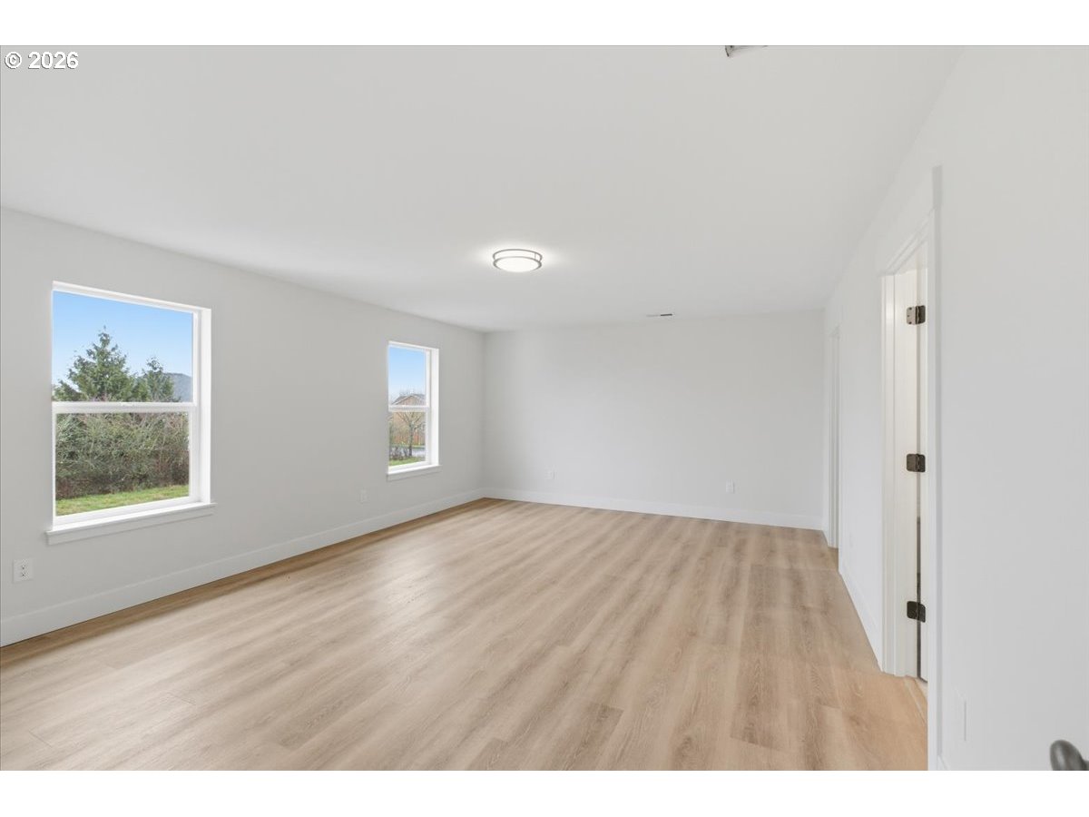 3191 Northwest 23rd Avenue Albany, OR 97321 - Photo 20 of 47 a view of an empty room with wooden floor and a window