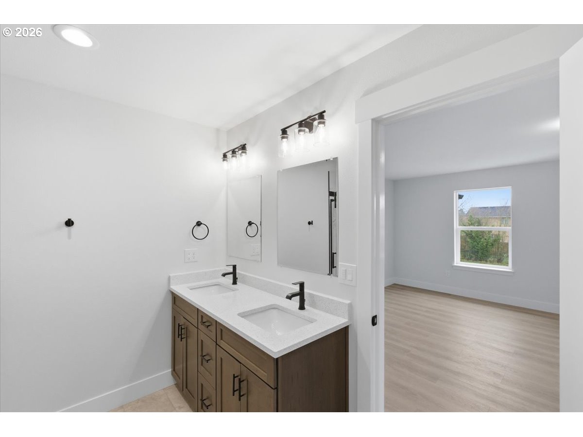 3191 Northwest 23rd Avenue Albany, OR 97321 - Photo 25 of 47 a bathroom with a sink mirror and vanity