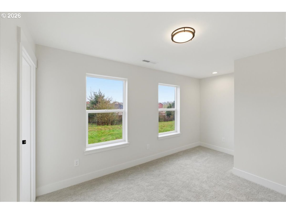 3191 Northwest 23rd Avenue Albany, OR 97321 - Photo 31 of 47 a view of an empty room with wooden floor and windows